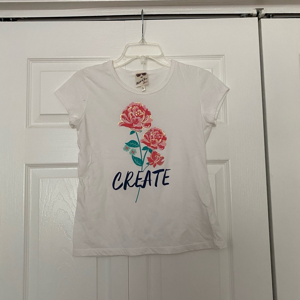 Girl white shirts with pink flowers on it